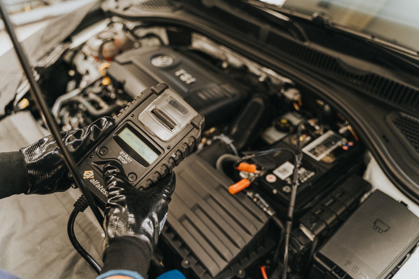Mechanic working on a car engine