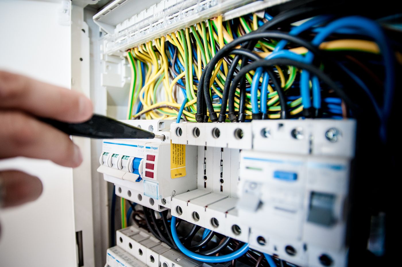 Electrician working on switchboard