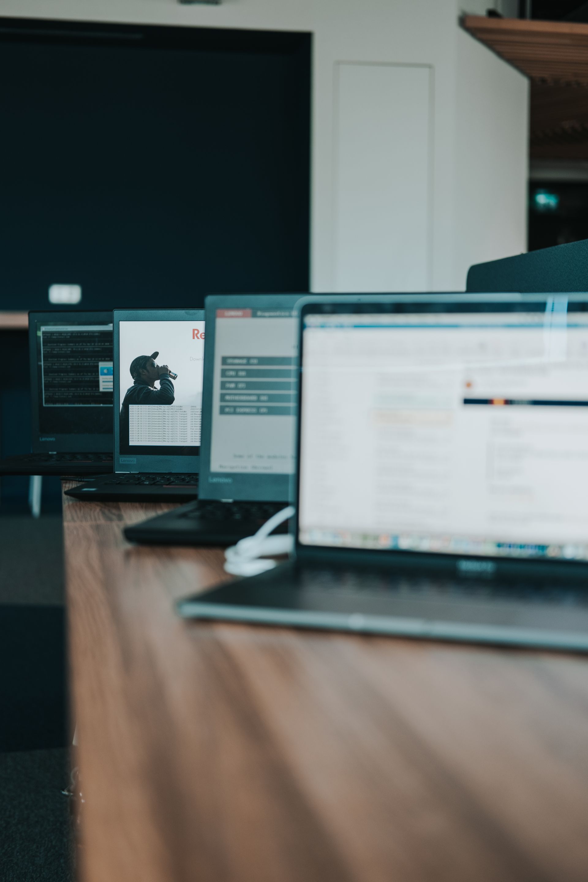 Laptops and IT devices on an office desk